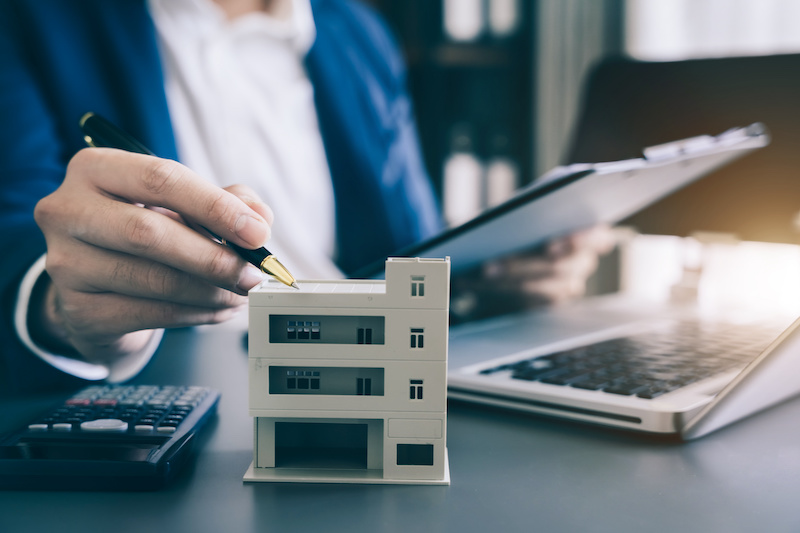 Home Insurance and Real estate investment concept, new client after signing agreement contract with approved property application form.