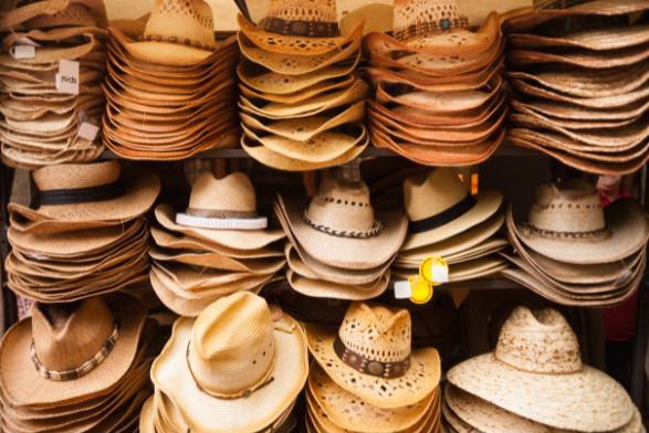 Straw and natural hide cowboy hats, found at retail Western Wear stores like the one acquired by our recent SBA 7a client.
